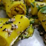 Delicious street food in Ahmedabad is displayed on a busy street corner.