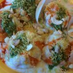 Chaat served with mint and tamarind chutney, sprinkled with dahi and sev