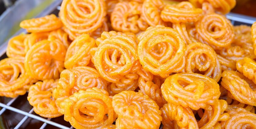 A mouthwatering view of a person selling orange jalebis in Rajasthan to everyone.