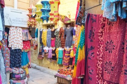 Vibrant street shopping in Ahmedabad selling traditional clothes and handicrafts.