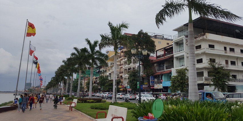 Stroll along Preah Sisowath Quay in Phnom Penh for scenic river views and local activities