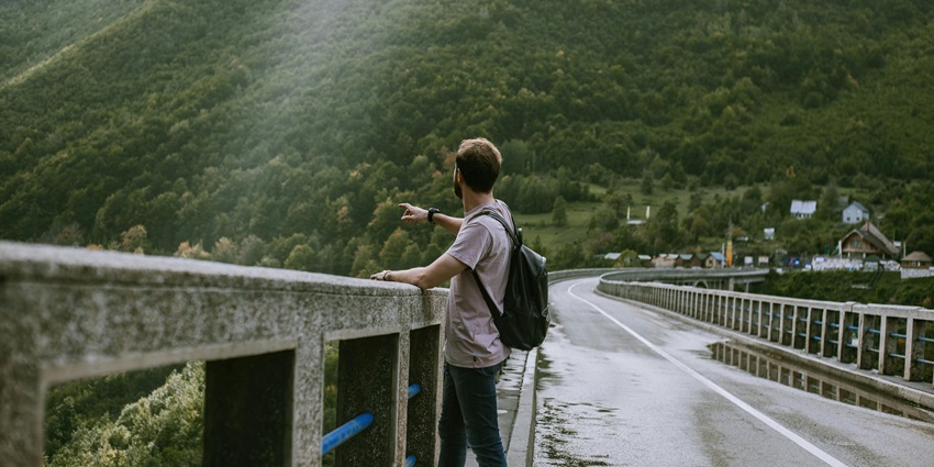 Man standing on a bridge, a scenic view at one of the best places near Mahabaleshwar.
