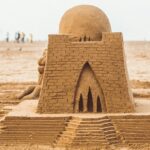 Exterior view of the Sudam Sand Art Museum in Odisha covered with a big sand sculpture