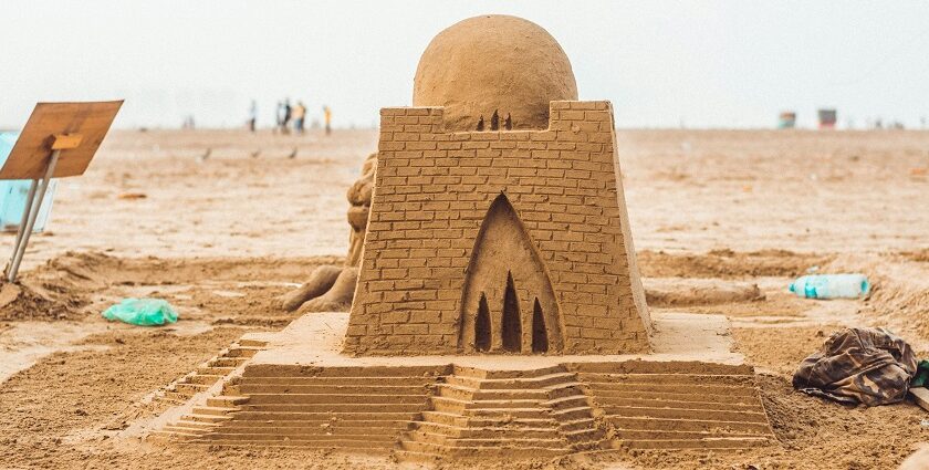 Exterior view of the Sudam Sand Art Museum in Odisha covered with a big sand sculpture