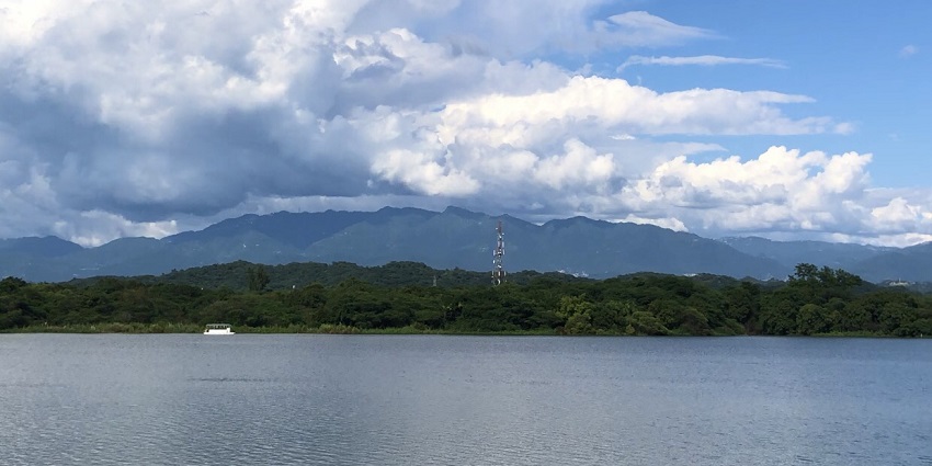 A breathtaking view of the quiet Sukhna Lake with Shivalik Hills in the background.