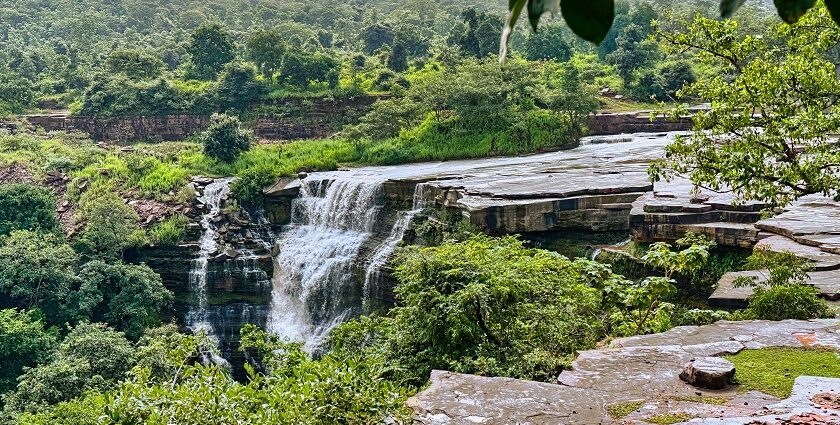 The landscape picture of the Sultan Garh Waterfalls with high mountains surrounding