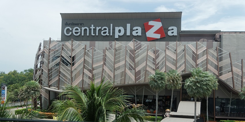 Surat Central Mall entrance with shoppers and fashion outlets.