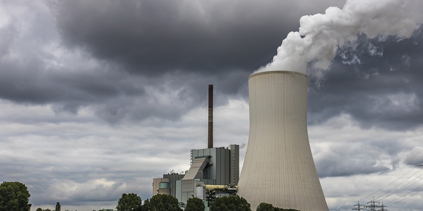 A cooling tower of a power plant near Sri Ganganagar, representing industrial development.