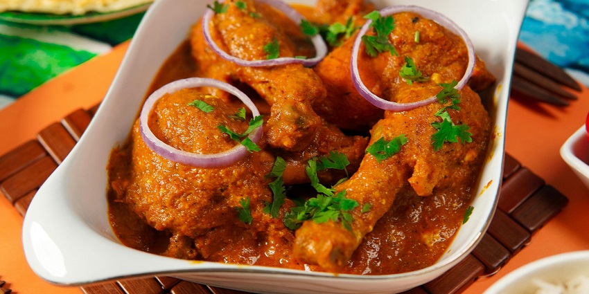 Indian butter chicken also known as Surti Chicken Masala with masala gravy and mint.