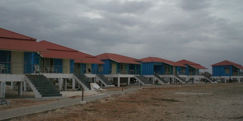 A picture of a beach with multiple cottages in sight, One of the best places to visit near Vijayawada