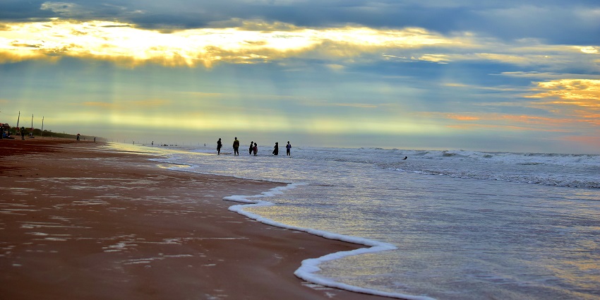 Picturesque view of Suryalanka beach at sunrise, ideal spot for all nature lovers