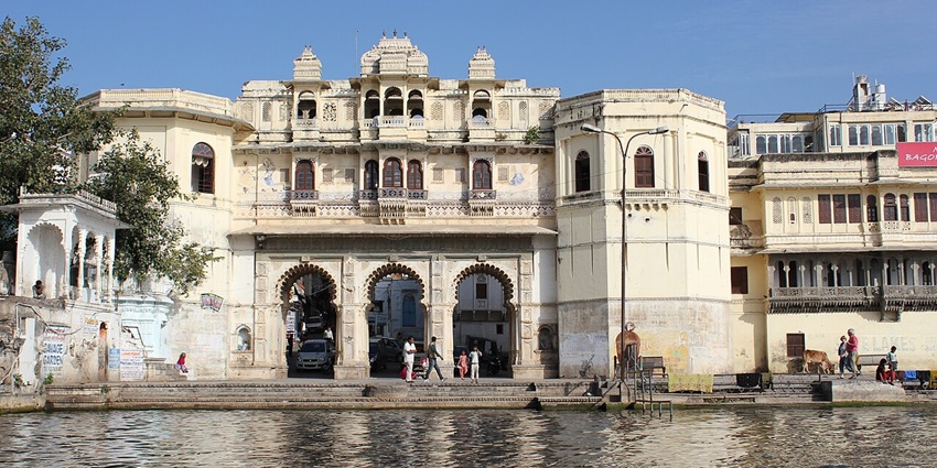 Lake Pichola at Lal Ghat, Udaipur, with traditional architecture reflecting in the water