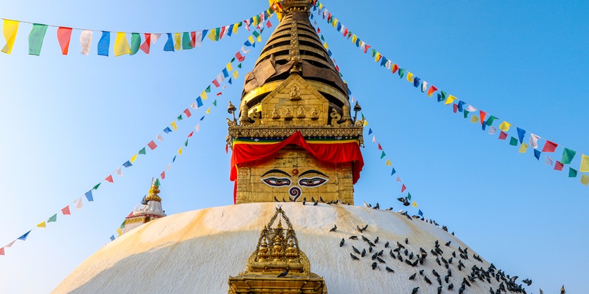 The image depicts the vibrant Swayambhunath temple, popular amongst Kathmandu temples.