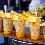 Freshly cooked sweet corn displayed for sale - one of the best street food in Vizag.