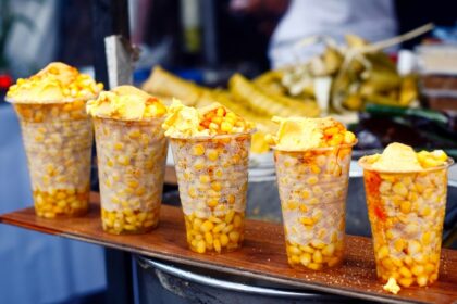 Freshly cooked sweet corn displayed for sale - one of the best street food in Vizag.