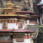 Taktsang Monastery perched on the cliffside, surrounded by the pristine Himalayan landscape in Bhutan.