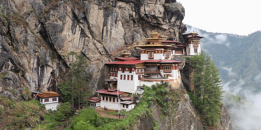 Taktsang Monastery clinging to a cliff with stunning Himalayan views in Bhutan.