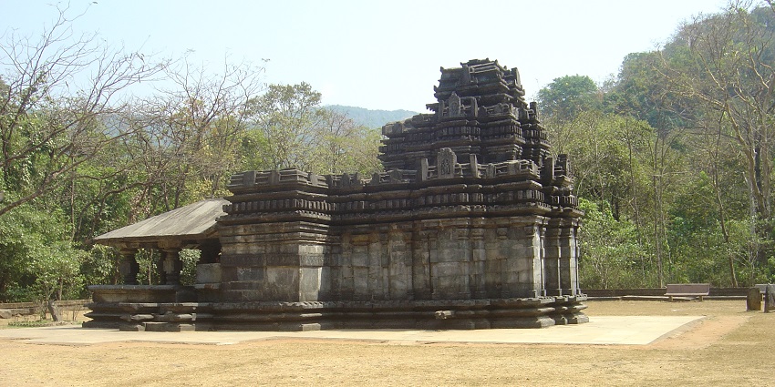 A picture of a temple in Goa with intricate carvings and traditional designs
