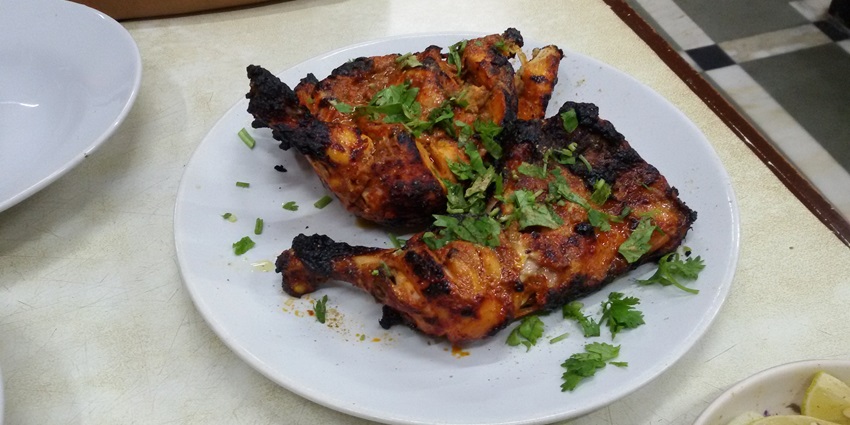 Tandoori chicken one of favourite dishes of all tourists as well as locals served on the streets of city