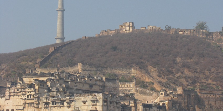 View of the Garh Palace in Taragarh fort with densely forested hills in the background