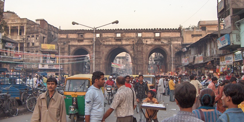 Teen Darwaza Market traditional textiles and handicrafts near the historic Teen Darwaza.