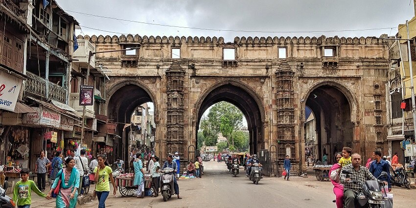 Crowd of people in the market in front of Teen Darwaza Mosque, one of the popular spots in Ahmedabad