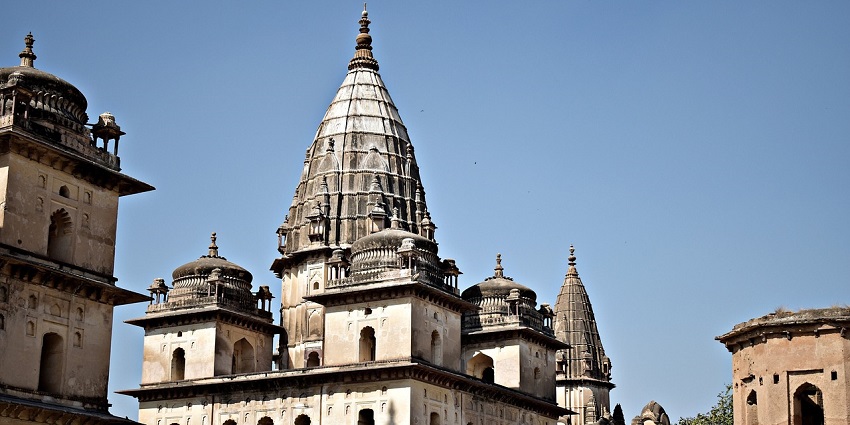 Historic cenotaphs with intricate architecture in Orchha amidst the beautiful vicinity of temple.
