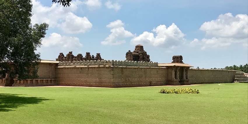 A mesmerising view of a temple surrounded by lush greenery where you can meditate.