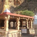 A breathtaking view of a white cave temple in Andhra Pradesh during the daytime.