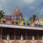 A stunning exterior view of a colourful temple in Andhra Pradesh during the daytime.