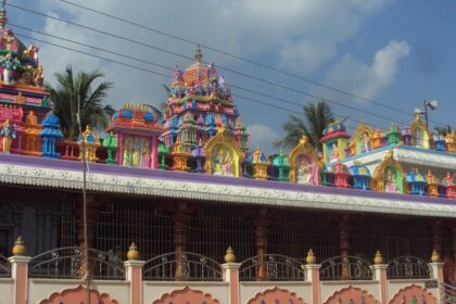 A stunning exterior view of a colourful temple in Andhra Pradesh during the daytime.