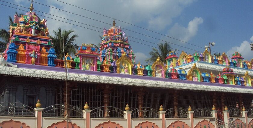 A stunning exterior view of a colourful temple in Andhra Pradesh during the daytime.