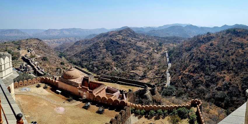 A bird’s eye view of the iconic tourist attraction surrounded by green-capped peaks.