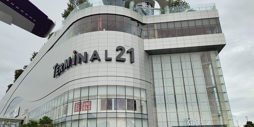 A view of Gate 2 entrance of Terminal 21 mall with people entering during the daytime.