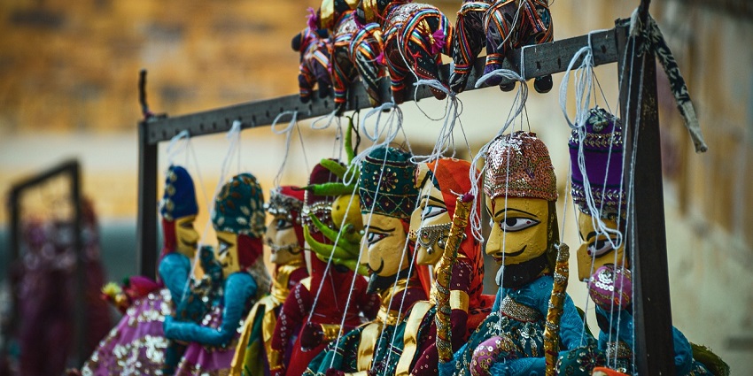 A traditional Rajasthani toy camel with vibrant colours displayed in Thar Heritage Museum