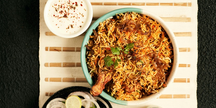 A flavorful plate of chicken biryani served at The Bamboo Hotel, famous for its Mughlai cuisine in Bharuch