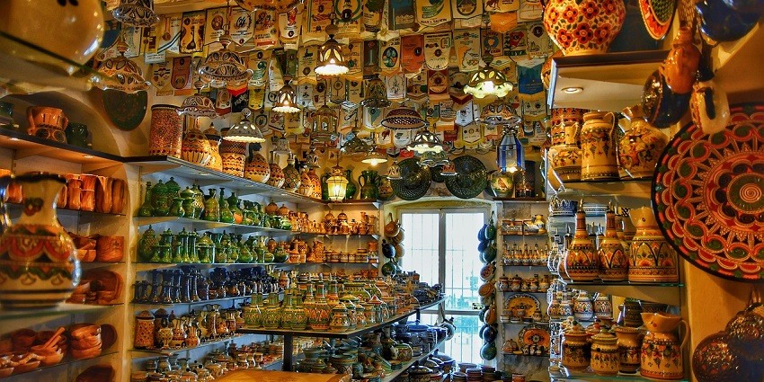 Traditional Bhutanese sight with handcrafted items and pottery on display.