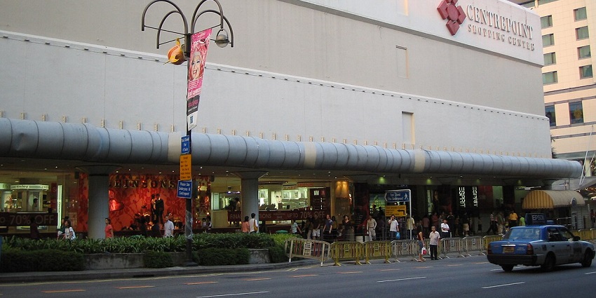 Interior view of the Centrepoint Mall, with shoppers exploring various retail stores and dining options