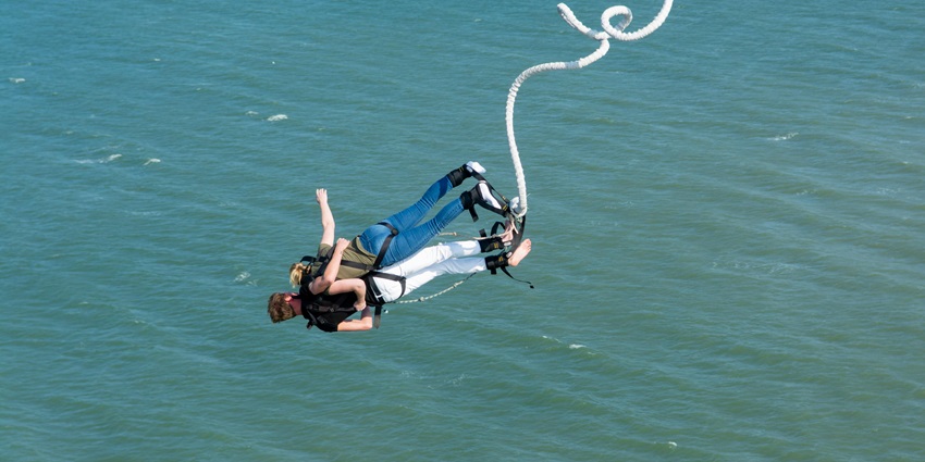 Two people enjoying bungee jumping in Pokhara, one of the top things to do here