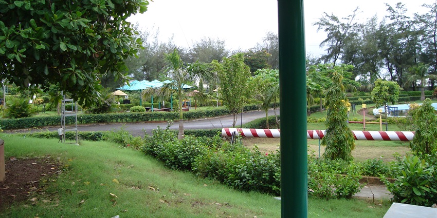A breathtaking view of the Goa Science Centre surrounded by lush greenery during the day.