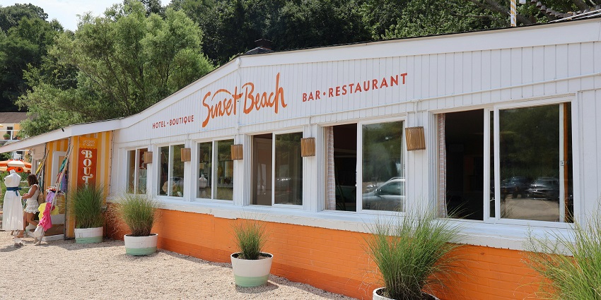 An image of a hotel and bar named sunset beach, perfect for cosy stays during nights.