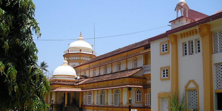 Side shot of the vibrant walls and intricate architecture of the temple