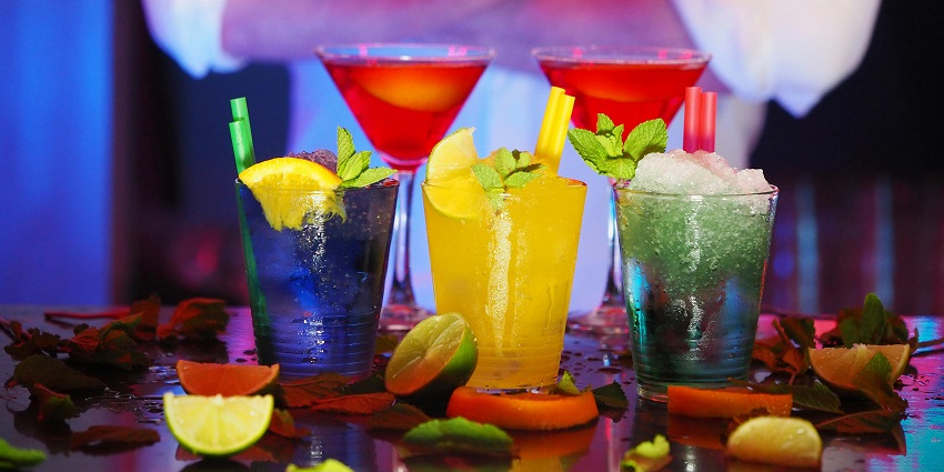 Selective blur of two wine glasses and three drinking glasses on a table setting