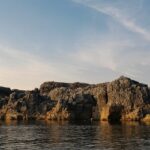 An image view of marble cliffs and the Narmada River located in Bhedaghat, showcasing exciting things to do in Bhedaghat.