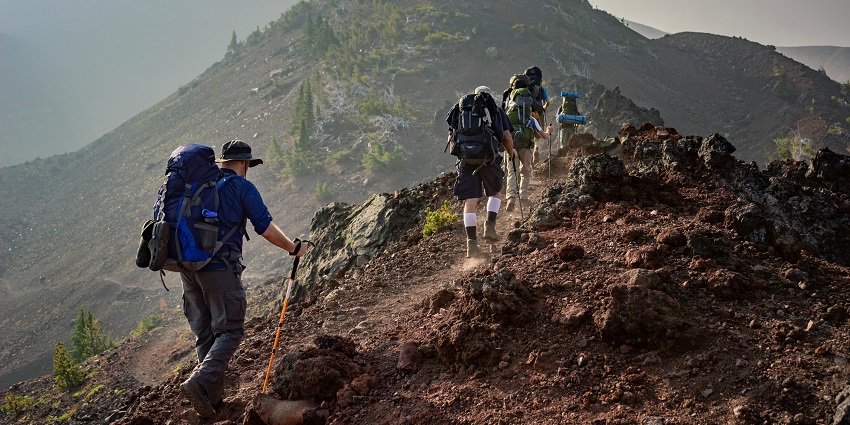 A glimpse of people trekking through the rustic terrains and rocky cliffs of Chhattisgarh.