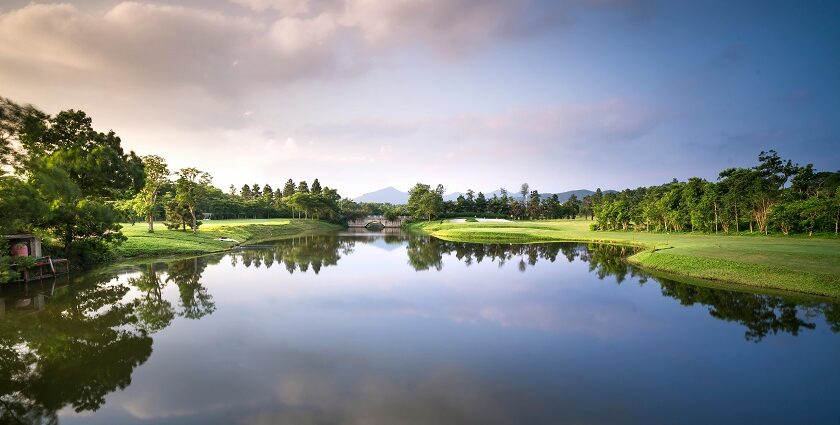 A breathtaking vista of a shimmering lake surrounded by greenery in Maharashtra.