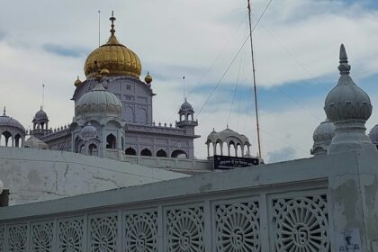 A view of the white beauty of a famous gurudwara adorned with golden hues in Punjab.