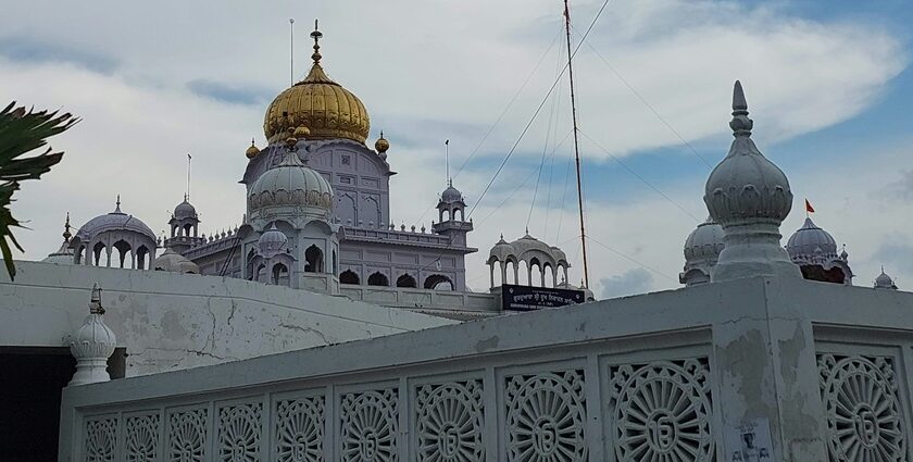 A view of the white beauty of a famous gurudwara adorned with golden hues in Punjab.