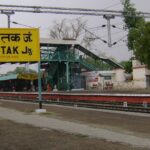 A view of Rohtak railway station, featuring its structure and surrounding area.