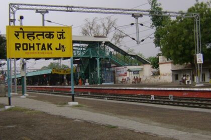 A view of Rohtak railway station, featuring its structure and surrounding area.